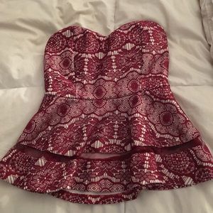 Strapless red and cream colored top